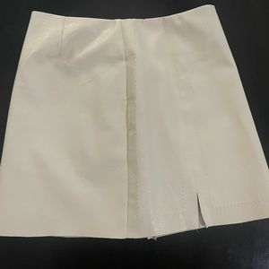 Faux leather mini skirt.  Off white.